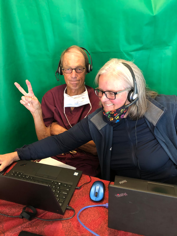 Pete Slabaugh and Kathleen Geier rehearsing at laptops for  online event